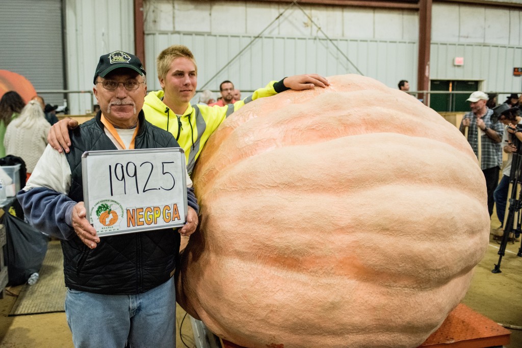 Gary Vincent of Plainville, CT stands next to his prize winning Giant Pumpkin on the first night of the Topsfield Fair in Topsfield, MA. Mr. Vincent's pumpkin weighed in at 1992.5 punds, beating out the second place finisher by 38.5 pounds.